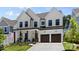 Beautiful two-story home with white siding, dark trim, covered porch, and attached two car garage at 18027 Wilbanks Dr, Charlotte, NC 28278