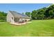 Wide backyard view featuring solar panels on the roof at 181 Brook Glen Dr # 56, Mooresville, NC 28115
