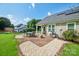 Spacious backyard with a patio and outdoor grill, perfect for entertaining at 181 Brook Glen Dr # 56, Mooresville, NC 28115