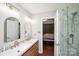 Modern bathroom features a double sink vanity, stylish fixtures, and a glass shower for a spa-like experience at 181 Brook Glen Dr # 56, Mooresville, NC 28115