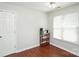Versatile room with hardwood floors, offering potential as a cozy guest room or functional home office at 181 Brook Glen Dr # 56, Mooresville, NC 28115
