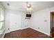 Bedroom with ceiling fan, hardwood floors, and closet at 181 Brook Glen Dr # 56, Mooresville, NC 28115