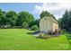 Backyard shed on a beautiful lawn with bordered landscaping at 181 Brook Glen Dr # 56, Mooresville, NC 28115