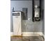 This utility room features a Generac PWRcell, Rinnai tankless water heater, and electrical panel at 181 Brook Glen Dr # 56, Mooresville, NC 28115