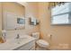 Clean and functional half bathroom with a modern sink, white fixtures, and a neutral color scheme, perfect for guests at 1930 Caprington Dr, Fort Mill, SC 29707