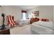 Comfortable bedroom featuring twin beds and a cozy chair, creating a welcoming space for relaxation and rest at 1930 Caprington Dr, Fort Mill, SC 29707