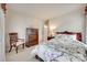 Bright bedroom featuring a decorative bed set, wood furniture and neutral walls, creating a calm and inviting space at 1930 Caprington Dr, Fort Mill, SC 29707