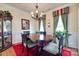 Formal dining room features a hardwood table with seating for four, perfect for entertaining guests at 1930 Caprington Dr, Fort Mill, SC 29707