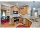 Well-designed kitchen with stainless steel appliances, granite countertops, and ample cabinet space for easy meal preparation at 1930 Caprington Dr, Fort Mill, SC 29707