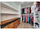 Organized walk-in closet featuring ample storage space with shelves, rods, drawers and a warm carpet, ensuring tidy wardrobe at 1930 Caprington Dr, Fort Mill, SC 29707