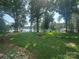 Expansive backyard featuring a fire pit and scenic lake views, perfect for outdoor entertaining at 195 Keats Rd, Mooresville, NC 28117