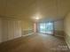 Basement with carpet and sliding door to backyard at 195 Keats Rd, Mooresville, NC 28117