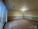 Spacious basement with carpet and sliding door to backyard at 195 Keats Rd, Mooresville, NC 28117