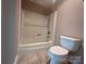 Bathroom featuring a shower-tub combo and toilet at 195 Keats Rd, Mooresville, NC 28117