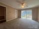 Bright bedroom with closet and sliding glass doors at 195 Keats Rd, Mooresville, NC 28117