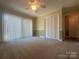 Carpeted bedroom with large window and double closet at 195 Keats Rd, Mooresville, NC 28117