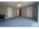 Carpeted bedroom with ceiling fan and natural light at 195 Keats Rd, Mooresville, NC 28117
