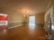 Dining room with hardwood floors, wainscoting and chandelier at 195 Keats Rd, Mooresville, NC 28117
