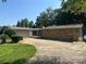 Ranch style home featuring stacked stone and attached carport at 195 Keats Rd, Mooresville, NC 28117