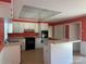 Bright kitchen featuring white cabinets and an island with cooktop at 195 Keats Rd, Mooresville, NC 28117