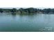 Beautiful open water and lake view with shoreline lined with trees and homes at 195 Keats Rd, Mooresville, NC 28117