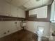 Laundry area with cabinets and utility sink at 195 Keats Rd, Mooresville, NC 28117