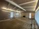 Spacious living room with wood ceiling beams and fireplace at 195 Keats Rd, Mooresville, NC 28117