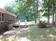 Backyard view featuring a wooden deck perfect for outdoor enjoyment at 2116 Upson Dr, Lancaster, SC 29720