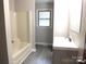 Clean bathroom with new vanity, neutral paint, and tiled floors at 2116 Upson Dr, Lancaster, SC 29720
