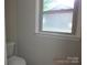 Simple half-bathroom with toilet and a natural light at 2116 Upson Dr, Lancaster, SC 29720