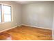 Bright bedroom with hardwood floors and a large window at 2116 Upson Dr, Lancaster, SC 29720