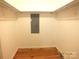 Walk-in closet featuring hardwood floors, built-in shelving, and lighting at 2116 Upson Dr, Lancaster, SC 29720