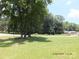 Expansive front yard with mature trees and lush lawn at 2116 Upson Dr, Lancaster, SC 29720