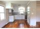 Updated kitchen with stainless appliances, white cabinets, and hardwood floors at 2116 Upson Dr, Lancaster, SC 29720