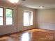 Well-lit living room showcasing hardwood floors, neutral walls, and natural light at 2116 Upson Dr, Lancaster, SC 29720
