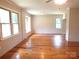 Inviting living room with hardwood floors, neutral walls, and several windows at 2116 Upson Dr, Lancaster, SC 29720