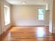 Bright living room featuring natural light, hardwood floors, and fresh neutral paint at 2116 Upson Dr, Lancaster, SC 29720