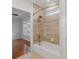 Bathroom with a decorative tiled shower, and a doorway to the bedroom at 215 Cedar St, Belmont, NC 28012