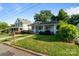 Quaint home with a cozy front porch, stone walkway, and well-maintained lawn, in a quiet neighborhood at 215 Cedar St, Belmont, NC 28012