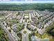 Expansive aerial view of a well-planned community with lush landscaping, ponds, and organized street layout at 2203 Whitford Ln, Charlotte, NC 28210