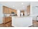 Bright kitchen with granite countertops, stainless steel appliances, ample wooden cabinetry, and eat-in breakfast bar at 2203 Whitford Ln, Charlotte, NC 28210