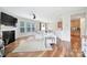 Spacious living room featuring hardwood floors, a fireplace, and a ceiling fan, with an open layout at 2203 Whitford Ln, Charlotte, NC 28210