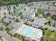 Community pool area and parking lot surrounded by townhomes and mature shade trees at 2203 Whitford Ln, Charlotte, NC 28210
