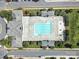 Aerial view of a community pool surrounded by trees, lounge chairs, and well maintained green space at 2203 Whitford Ln, Charlotte, NC 28210