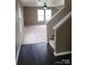 Inviting living room with hardwood flooring, neutral paint, and ample natural light at 2440 Mint Thistle Ct, Charlotte, NC 28269