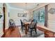 Elegant dining room with hardwood floors, chandelier lighting, and ample natural light from a large window at 2630 Filson Ct, Charlotte, NC 28214