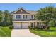 Charming two-story home with a well-manicured lawn, a two-car garage, and a welcoming front porch at 2630 Filson Ct, Charlotte, NC 28214