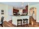 Eat-in kitchen featuring a breakfast bar with granite countertops and stainless steel appliances at 2630 Filson Ct, Charlotte, NC 28214