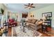 Inviting living room boasts hardwood floors, a ceiling fan, and seamless flow to the kitchen area at 2630 Filson Ct, Charlotte, NC 28214