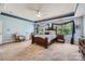 Well-lit main bedroom showcasing a tray ceiling and large windows at 2630 Filson Ct, Charlotte, NC 28214